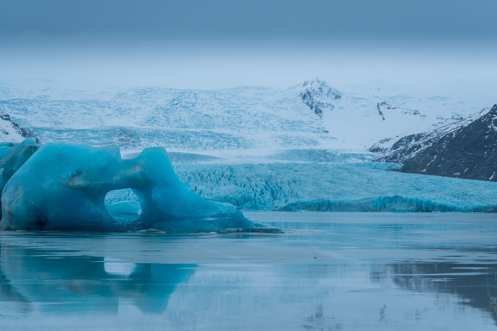 Fjallsárlón glacier lagoon with a large iceberg in foreground