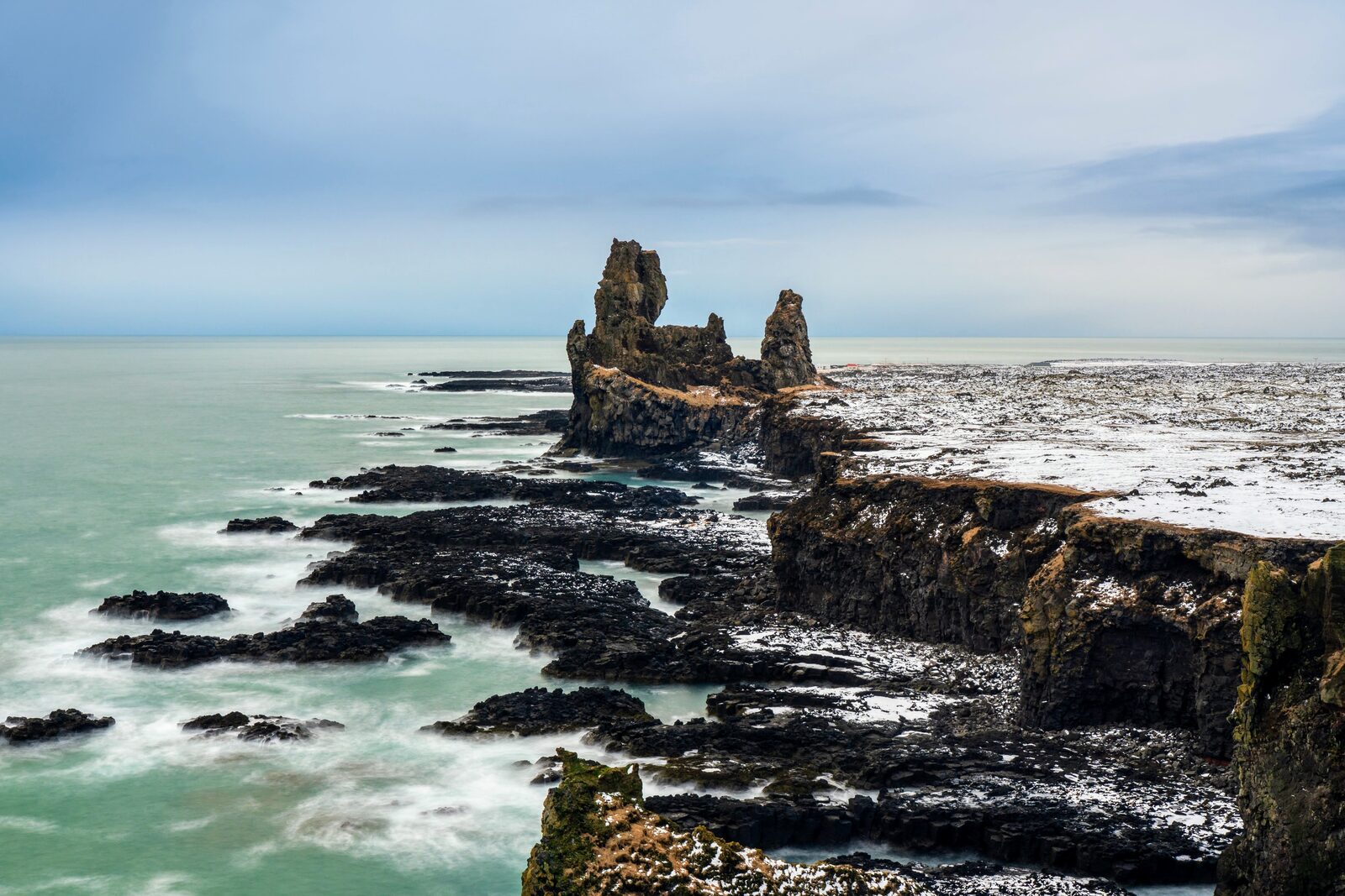 The Lóndrangar basalt pinnacles rising from the sea